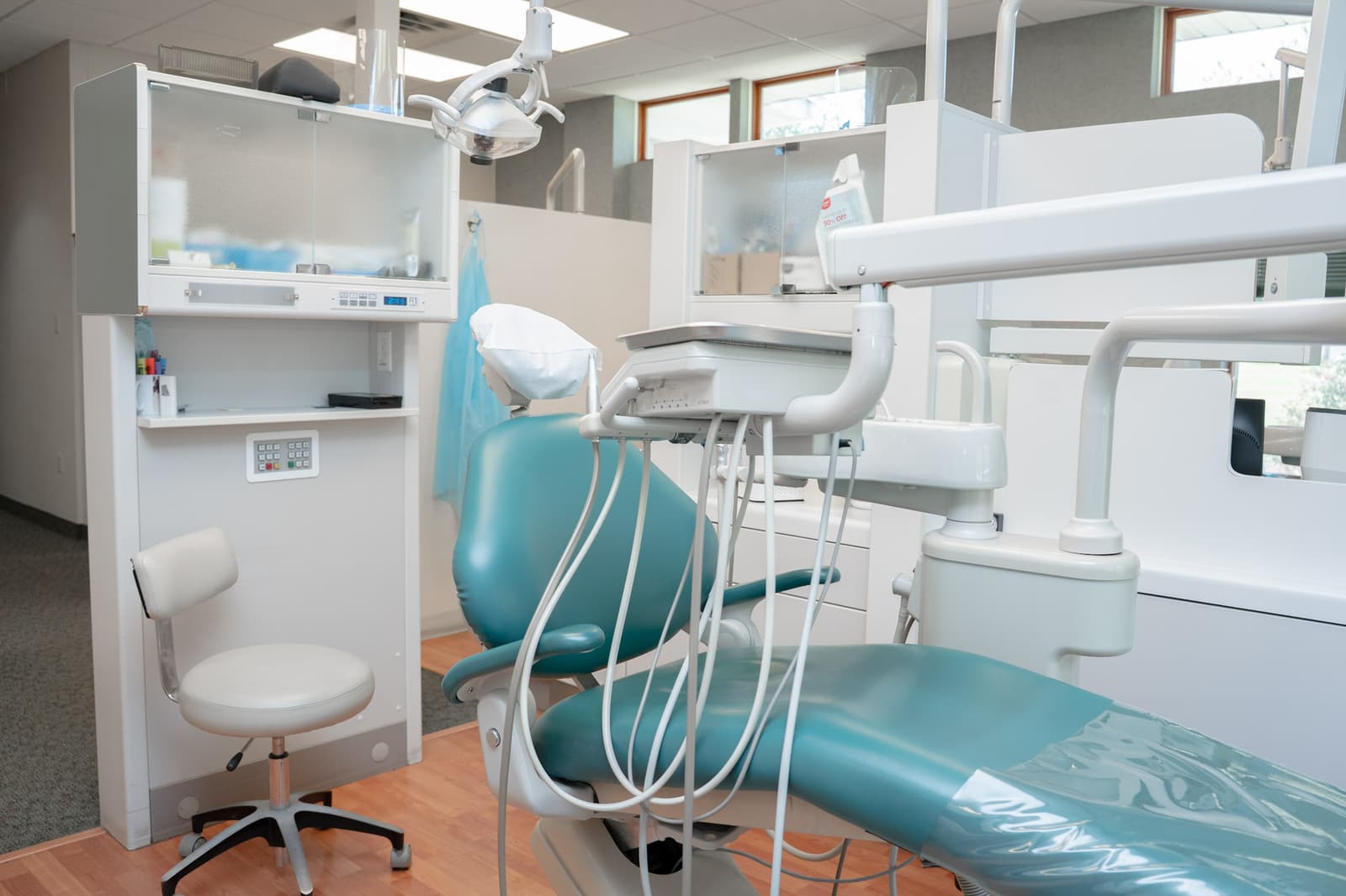 Dental chair and instrument tray in the open treatment area